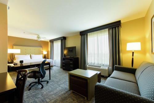 a hotel room with a bed and a desk at Homewood Suites by Hilton Phoenix Chandler Fashion Center in Chandler