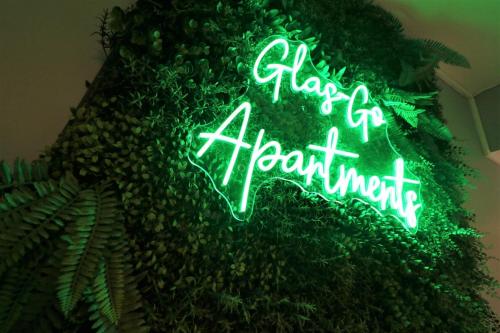 a neon sign that says play of heart istg at 2 Bedroom Apartment at SECC Hydro FREE PARKING in Glasgow