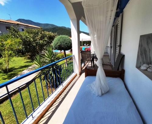 a balcony with a bed and a view at Villa Riviera in Stavros