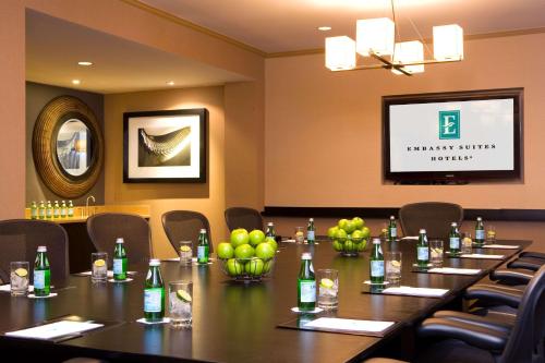 a conference room with a long table and bottles of wine at Embassy Suites by Hilton Portland Maine in Portland