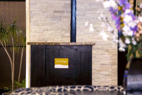 a black door with a yellow sign on it at DoubleTree by Hilton Portland, ME in South Portland