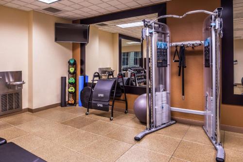 a fitness room with a gym with equipment at Hilton Garden Inn Bend in Bend
