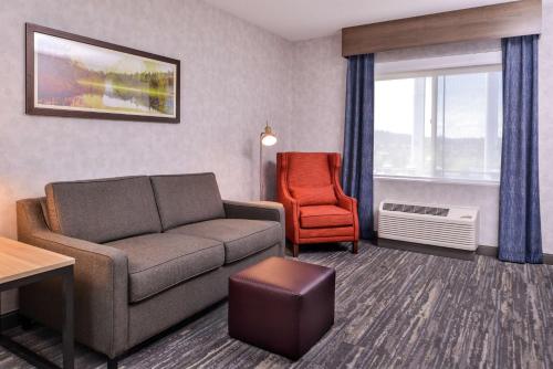 a living room with a couch and a chair at Hilton Garden Inn Bend in Bend