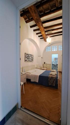 a bedroom with a large bed in a room at Affittacamere Garibaldi in Alcamo