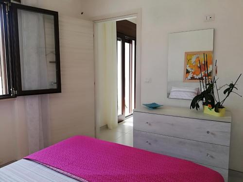 Ένα ή περισσότερα κρεβάτια σε δωμάτιο στο Casa Cinzia diamond 104