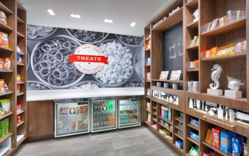 a pharmacy aisle with a treats sign on the wall at Hampton Inn & Suites Rockport-Fulton in Rockport