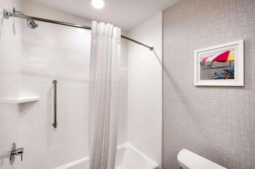 a bathroom with a shower with a shower curtain at Hampton Inn & Suites Rockport-Fulton in Rockport