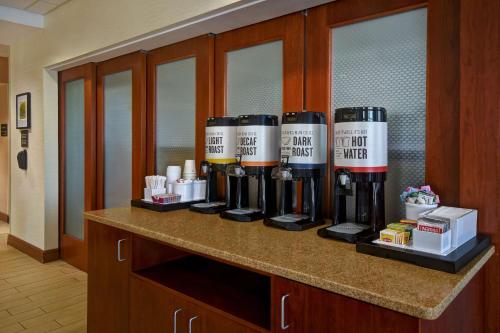 a row of bottles of wine on a counter at Hampton Inn Rutland/Killington in Rutland