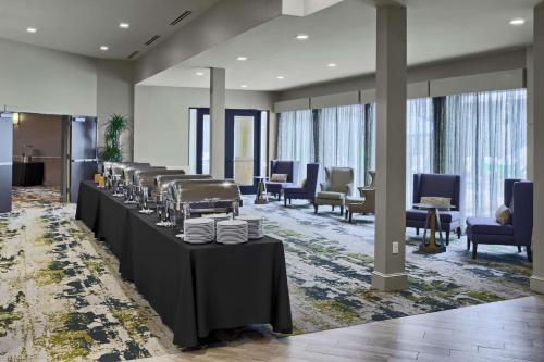 a dining room with tables with plates on them at DoubleTree by Hilton San Antonio Downtown in San Antonio