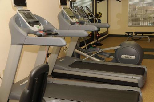a row of tread machines in a gym at Hilton Garden Inn New Braunfels in New Braunfels