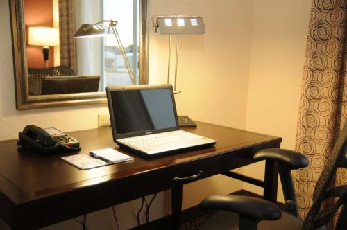 a laptop computer sitting on a desk in a hotel room at Hilton Garden Inn New Braunfels in New Braunfels