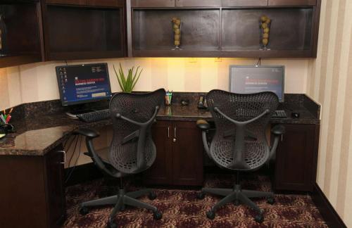 an office with two chairs and a desk with a computer at Hilton Garden Inn New Braunfels in New Braunfels