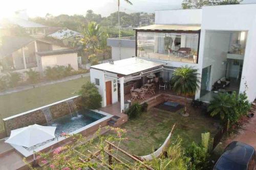 an aerial view of a house with a swimming pool at penaareia in Angra dos Reis