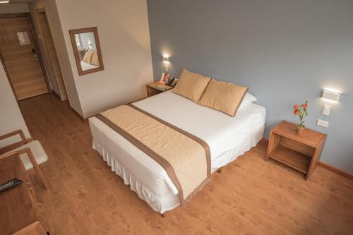 Postel nebo postele na pokoji v ubytování Hotel Ambato