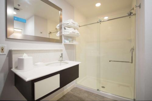 a bathroom with a sink and a shower at Hampton Inn Tiffin in Tiffin