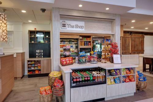 a store with a counter with food and drinks at Hilton Garden Inn Hamilton in Bordentown