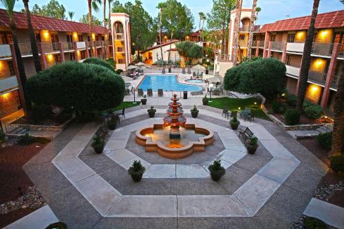 an overhead view of a courtyard with a fountain and a pool at DoubleTree Suites by Hilton Tucson Airport in Tucson