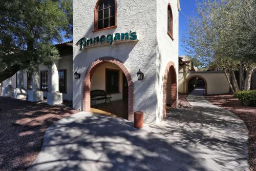 a white building with a sign that reads interns at DoubleTree Suites by Hilton Tucson Airport in Tucson