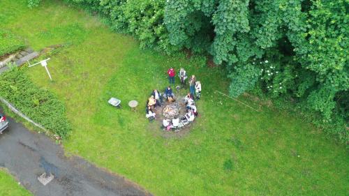 a group of people standing on a grass field at Wenckheim Vadászház in Nagyoroszi