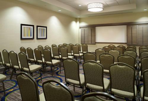 a conference room with rows of chairs and a whiteboard at Hilton Garden Inn Texarkana in Texarkana - Texas