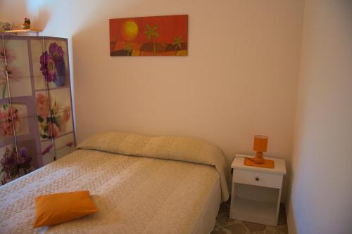 מיטה או מיטות בחדר ב-Monolocale Il Fenicottero