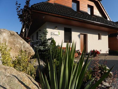 a house with a plant in front of it at Pinus Cembra in Stará Lesná