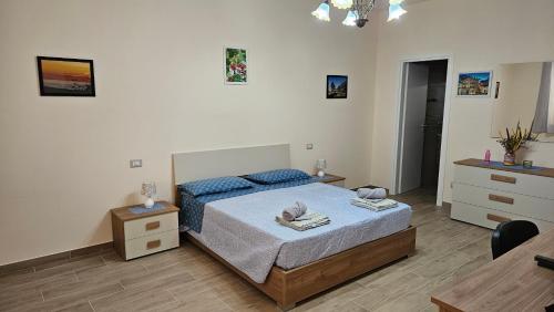 a bedroom with a bed and a table in it at B&B Nucria - Nocera Terinese in Nocera Terinese