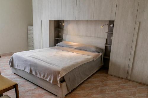 a bedroom with a large bed in a room at Terra di Mezzo in Castellanza