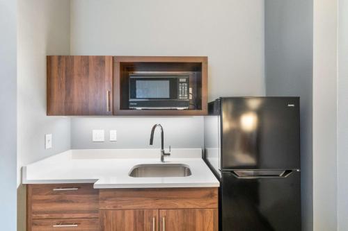 a kitchen with a sink and a microwave at Hampton Inn Winchester in Winchester