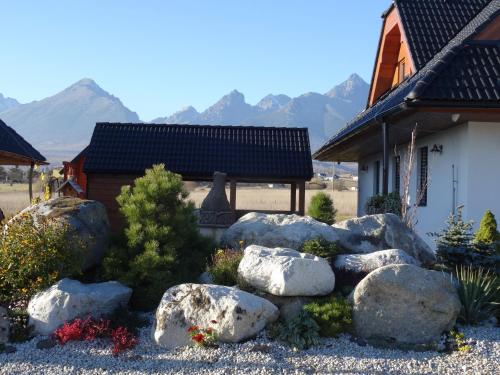 a garden of rocks in front of a house at Pinus Cembra in Stará Lesná