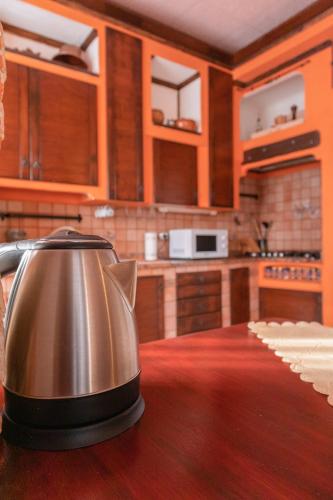 a tea kettle sitting on the counter of a kitchen at Terra di Mezzo in Castellanza