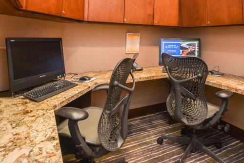 an office with two chairs and a desk with a computer at Hilton Garden Inn Yuma Pivot Point in Yuma