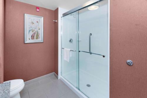 a bathroom with a shower and a toilet at Hampton Inn Butler in Butler