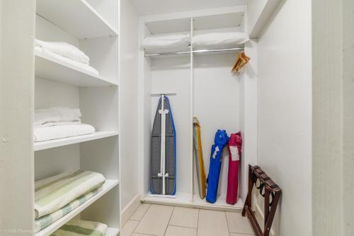 a walk in closet filled with umbrellas at Soleado Hotel in Fort Lauderdale