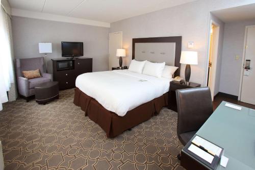 a hotel room with a large bed and a television at DoubleTree by Hilton Boston/Westborough in Westborough