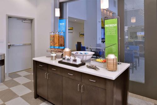 a bathroom with a counter with a sink and a mirror at Hampton Inn & Suites Shelby, North Carolina in Shelby