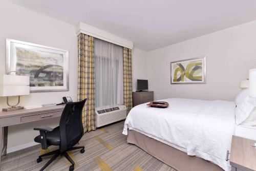 a hotel room with a bed and a desk and a computer at Hampton Inn & Suites Shelby, North Carolina in Shelby