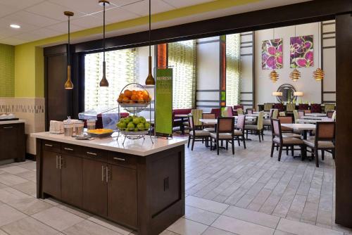 a lobby of a hotel with a table with fruit on it at Hampton Inn & Suites Dallas Market Center in Dallas