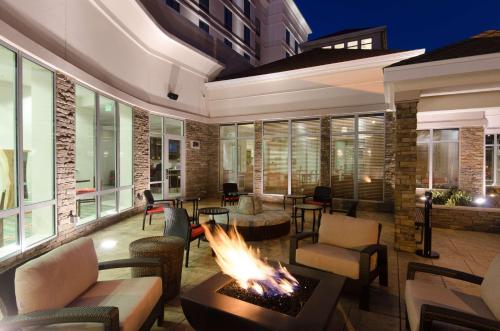 a patio with a fire pit and tables and chairs at Hilton Garden Inn Hickory in Hickory