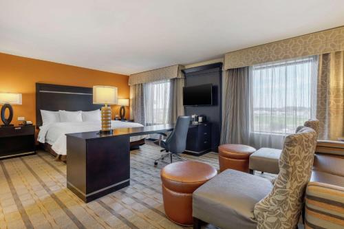 a hotel room with a bed and a desk at Hampton Inn and Suites Columbus, MS in Columbus