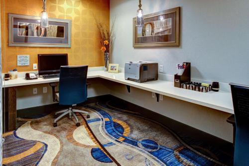 an office with a desk with a computer and a chair at Hampton Inn and Suites Columbus, MS in Columbus