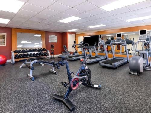 a gym with several treadmills and exercise bikes at Hilton Garden Inn Las Vegas Strip South in Las Vegas