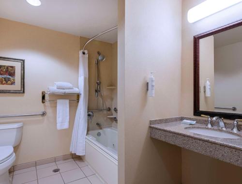a bathroom with a sink and a toilet and a tub at Hilton Garden Inn Las Vegas Strip South in Las Vegas
