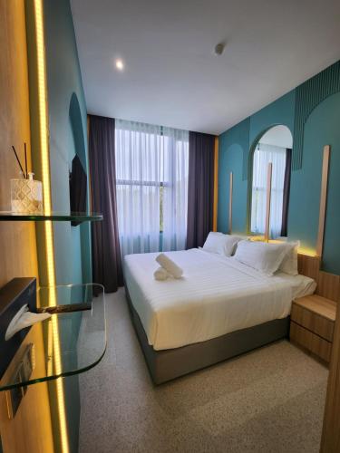 Postel nebo postele na pokoji v ubytování Wellesley Hotel