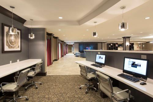 an office with a desk with a computer on it at DoubleTree by Hilton Schenectady in Schenectady