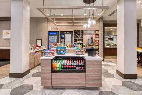 a store with a display of soda sodas at Hilton Garden Inn Irvine/Orange County Airport in Irvine