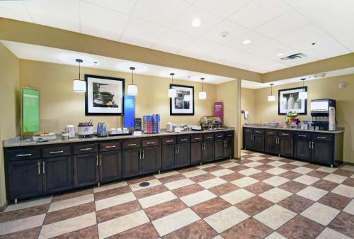 a large room with cabinets and a checkerboard floor at Hampton Inn & Suites Milwaukee/Franklin in Franklin
