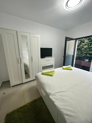 Postel nebo postele na pokoji v ubytování Green Central Apartment