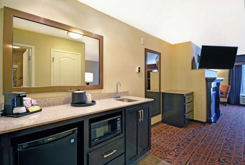 a hotel bathroom with a sink and a mirror at Hampton Inn & Suites Milwaukee/Franklin in Franklin