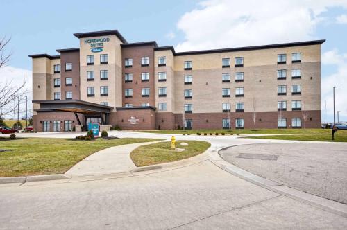 a large building with a fire hydrant in front of it at Homewood Suites by Hilton Cincinnati/West Chester in West Chester